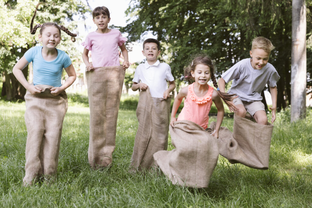 front-view-kids-playing-with-potato-bags